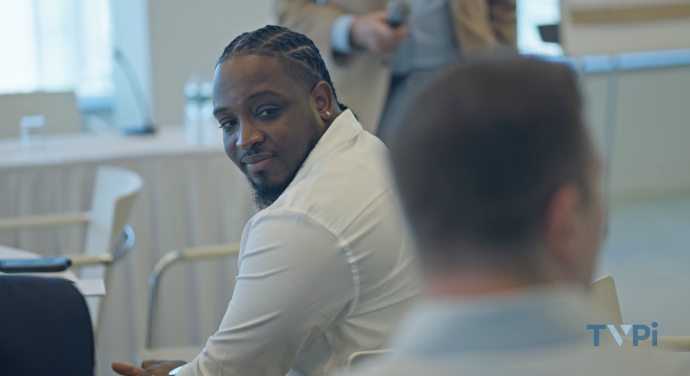 An attendee engaged in conversation at Intersect