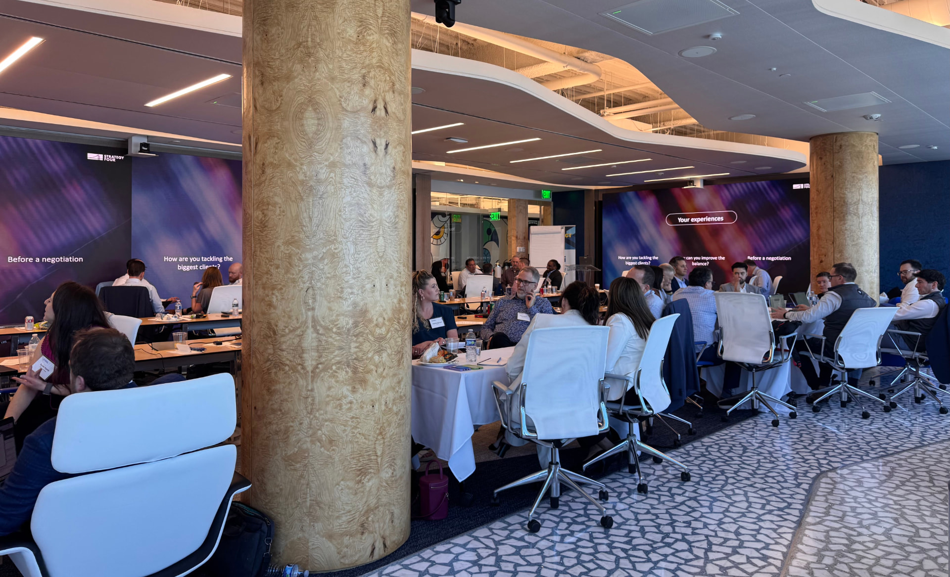 Intersect attendees in roundtable sessions around the room